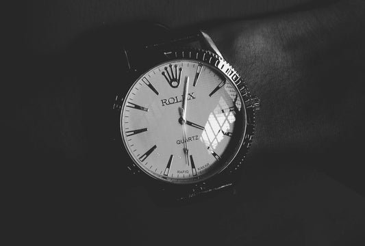 Rolex Photo by hassan mehdi: https://www.pexels.com/photo/round-white-silver-colored-rolex-analog-watch-displaying-4-03-time-1353065/